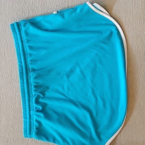 Turquise TERRYCLOTH mini skirt with white trim.  Ties at waist.  Size is 19 XXL - Picture 2 of 6